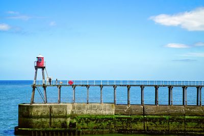 Pier over sea against sky