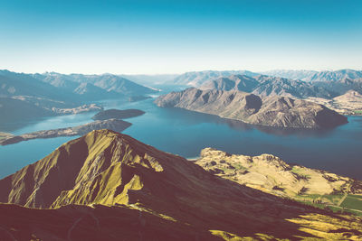 Scenic view of mountains against clear blue sky