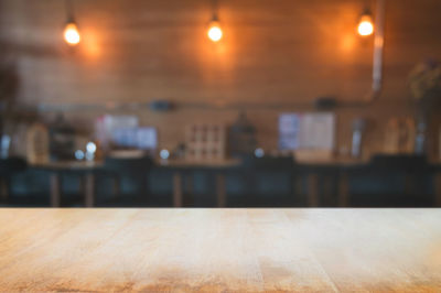 Close-up of illuminated lights on table at restaurant