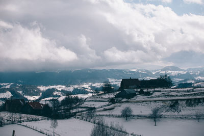 Scenic view of mountains against sky during winter