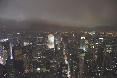 Illuminated cityscape against sky at night in empire state.