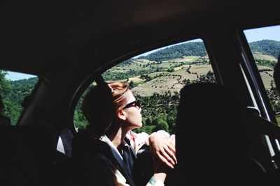 Rear view of people sitting in train