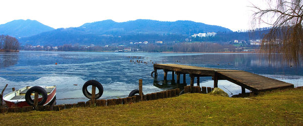 Scenic view of lake and mountains against sky