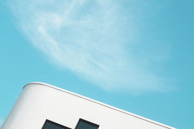 Low angle view of building against blue sky