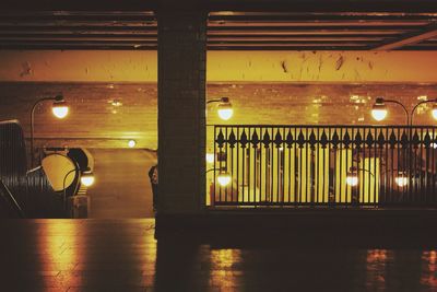 Illuminated lamp post at night