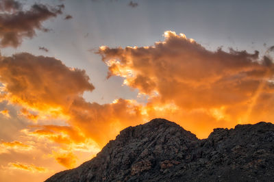 Low angle view of dramatic sky during sunset