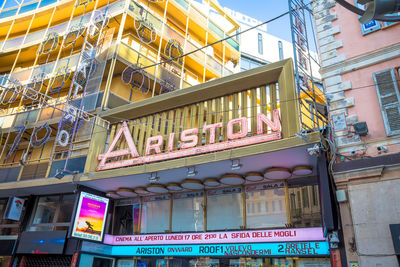 Low angle view of information sign on building