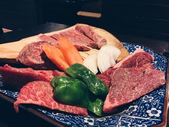 High angle view of vegetables in plate on table