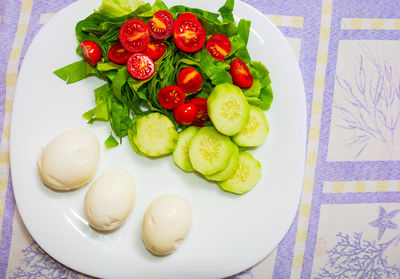 High angle view of fruits in plate on table