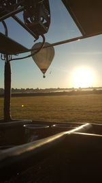 Scenic view of field against sky during sunset