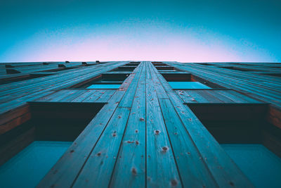 Low angle view of building against clear blue sky