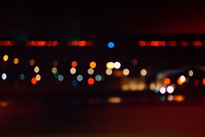 Defocused image of illuminated street lights at night