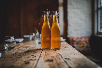 Glass of bottles on table