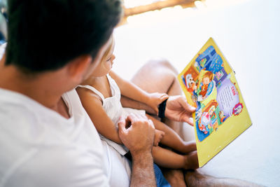 Side view of boy using digital tablet