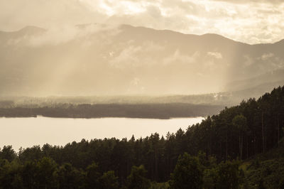 Scenic view of landscape against sky at sunset