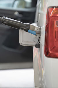 Fuel up the natural gas vehicle at the station. price increase concept