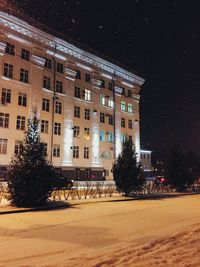 Buildings in city at night