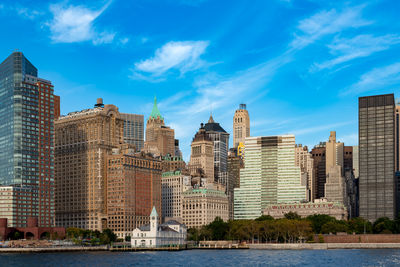 Buildings in city against sky