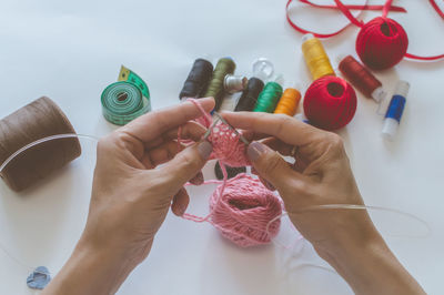 Cropped hand of woman crocheting