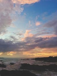 Scenic view of sea against sky at sunset