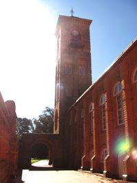 Clock tower in city against sky