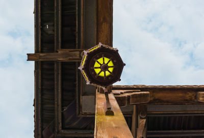 Low angle view of illuminated lamp against sky