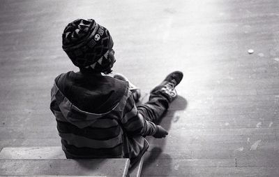 Boy sitting outdoors