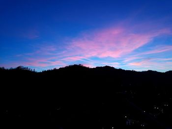 Silhouette trees against sky during sunset