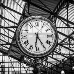 Low angle view of clock on ceiling