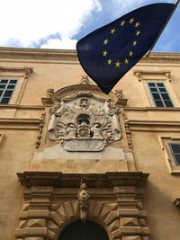 Low angle view of statue against building