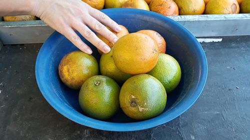 Close-up of hand with fruits