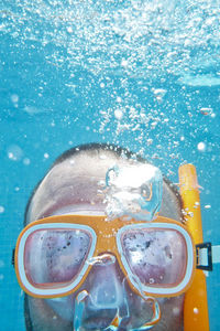 Close-up of mature man snorkeling in sea