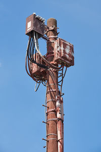 Low angle view of tower against clear blue sky