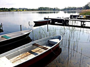 Boats moored in river
