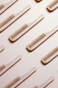 Wooden comb on pink table