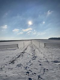 Scenic view of land against sky during winter