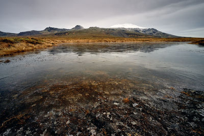 Frozen sea bay near mountains