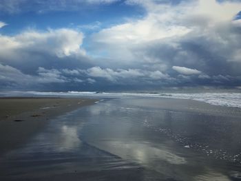 Scenic view of beach against sky