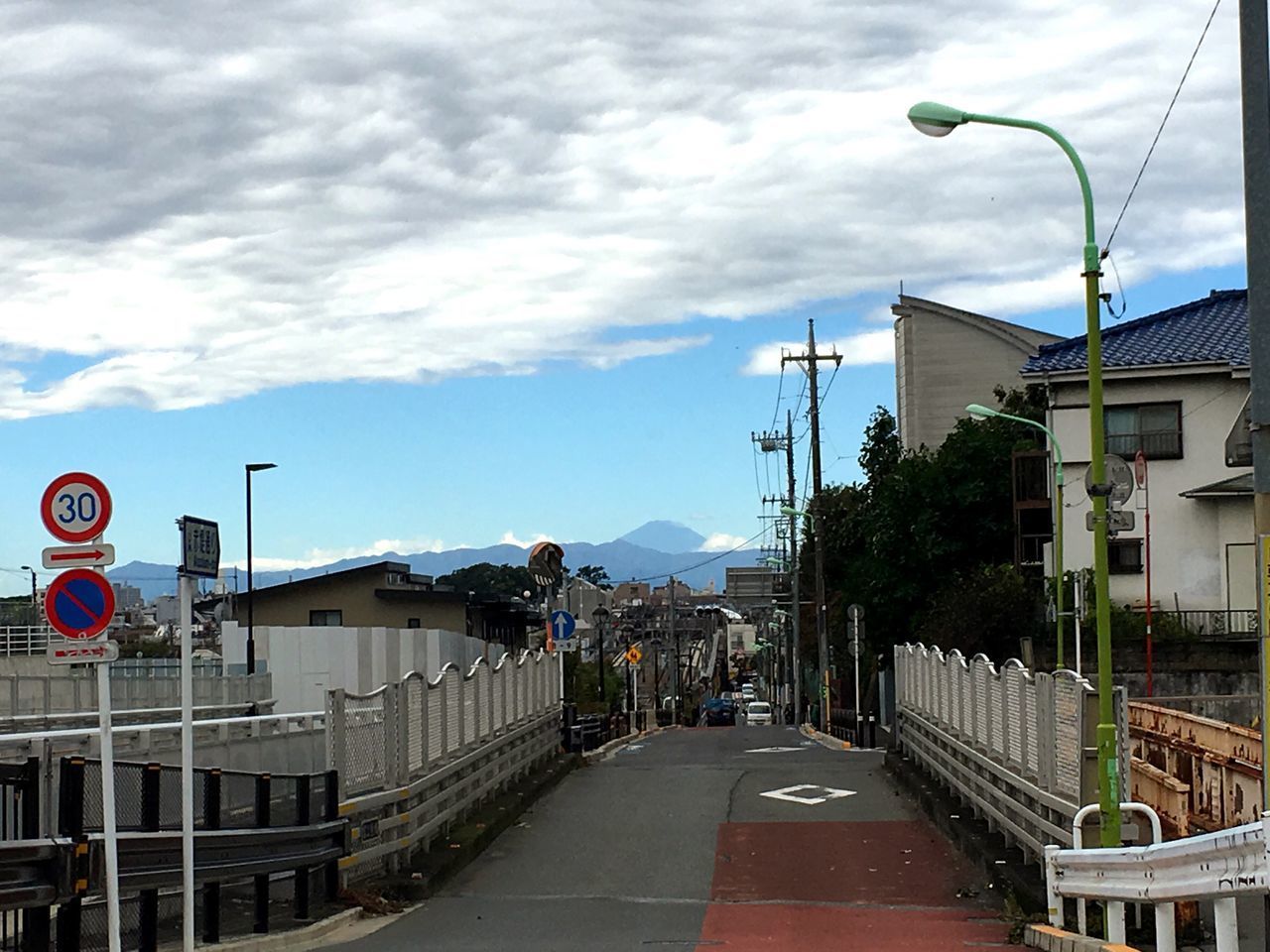 ROAD BY STREET AGAINST SKY