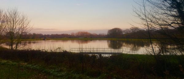 Scenic view of lake against sky during sunset