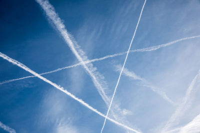 Low angle view of vapor trails in sky