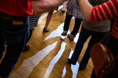 High angle view of people standing on floor