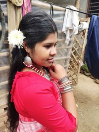 Side view of woman wearing traditional clothing looking away