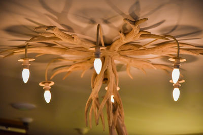 Low angle view of illuminated light bulb