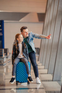 Father and daughter at airport