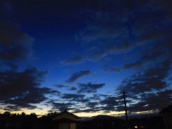 Low angle view of dramatic sky at night