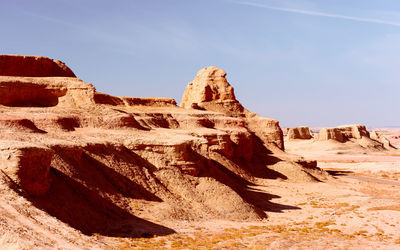 Rock formation in desert against clear sky