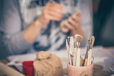 Close-up of hand holding painting