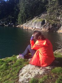 Woman sitting on rocks