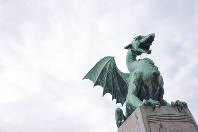 Low angle view of statue against sky